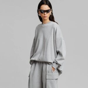 The Frankie Shop Open Back Jennings Crewneck Long Sleeve Sweater in Black